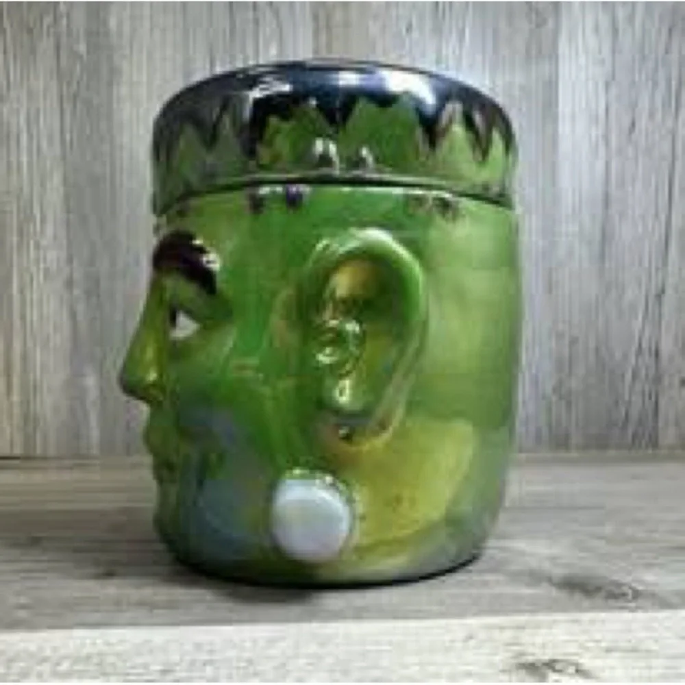 Green Frankenstein oversized candle - bobbing for apples